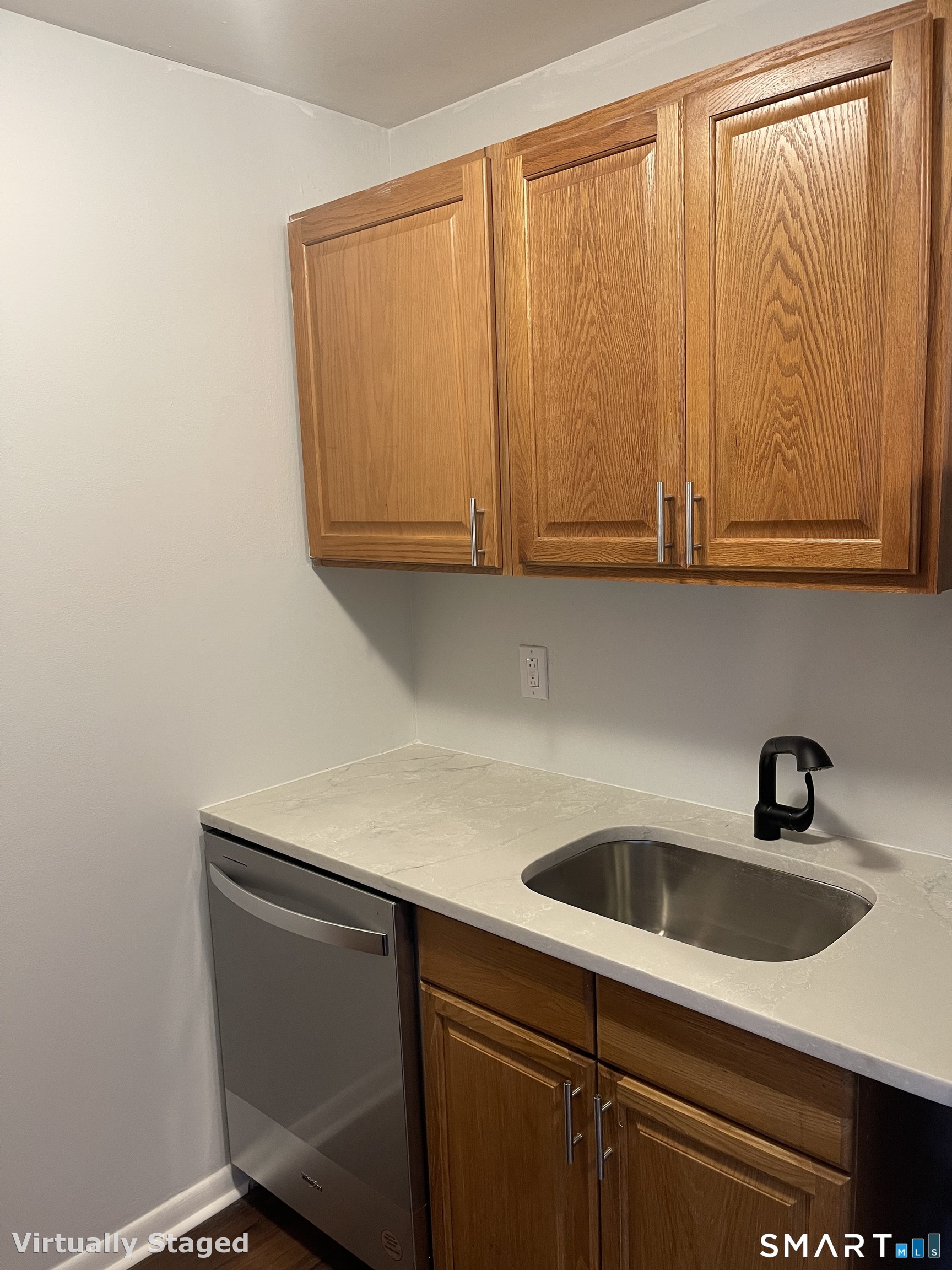 45 Monroe Street, Unit B2 Bridgeport, CT 06605 - Photo 10 of 12 a kitchen with a sink cabinets and a window