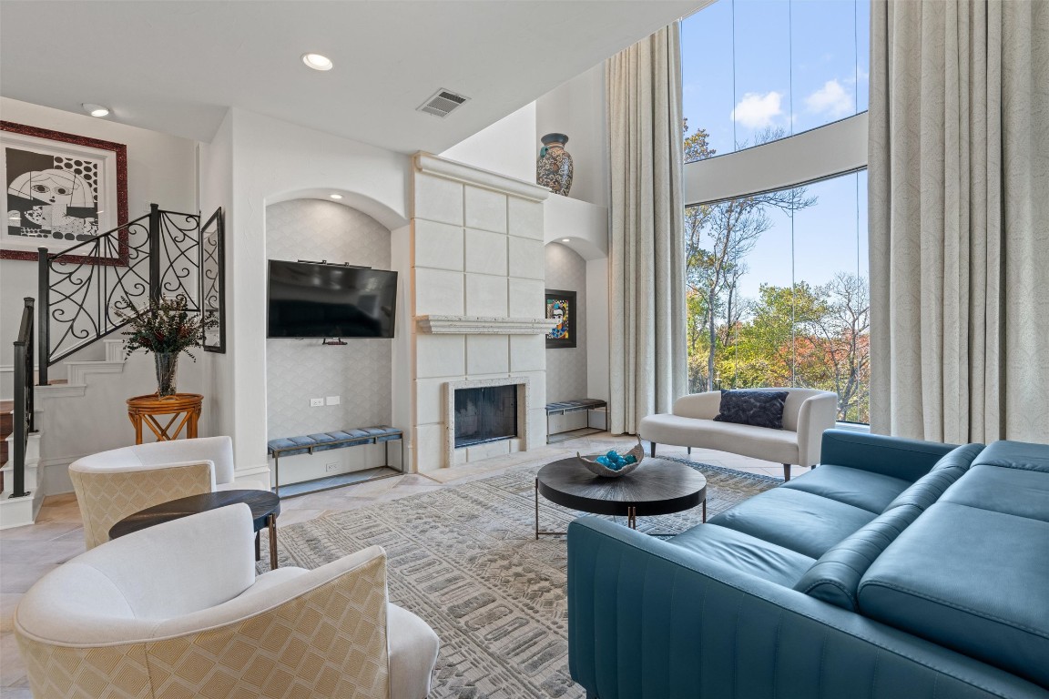 5706 Long Court Austin, TX 78730 - Photo 11 of 40 a living room with fireplace furniture and a flat screen tv