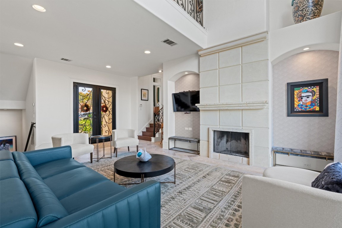 5706 Long Court Austin, TX 78730 - Photo 12 of 40 a living room with furniture a fireplace and a flat screen tv