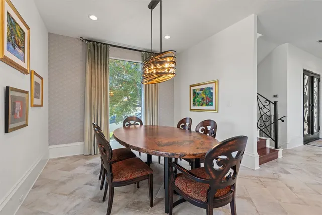 a dining room with furniture and window