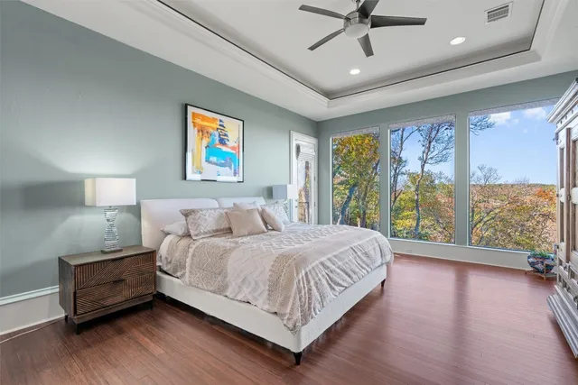 a bedroom with a large bed and a large window