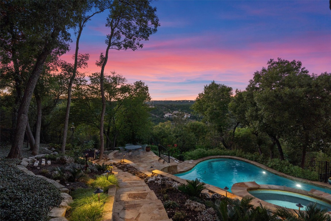 5706 Long Court Austin, TX 78730 - Photo 2 of 40 a view of a swimming pool with a yard