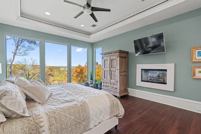 a bedroom with a large bed and a large window