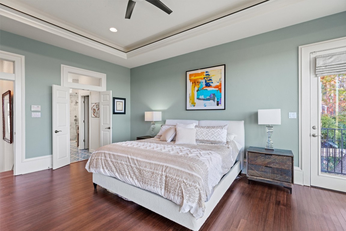 5706 Long Court Austin, TX 78730 - Photo 23 of 40 a bedroom with a bed and a painting on the wall