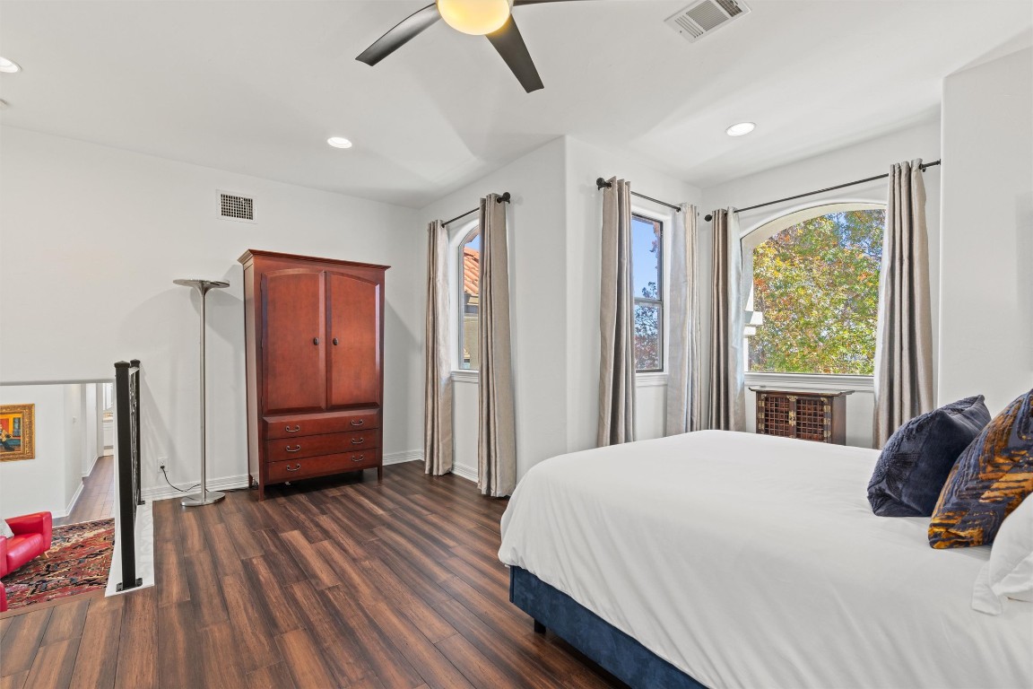 5706 Long Court Austin, TX 78730 - Photo 32 of 40 a bedroom with a bed and a large window