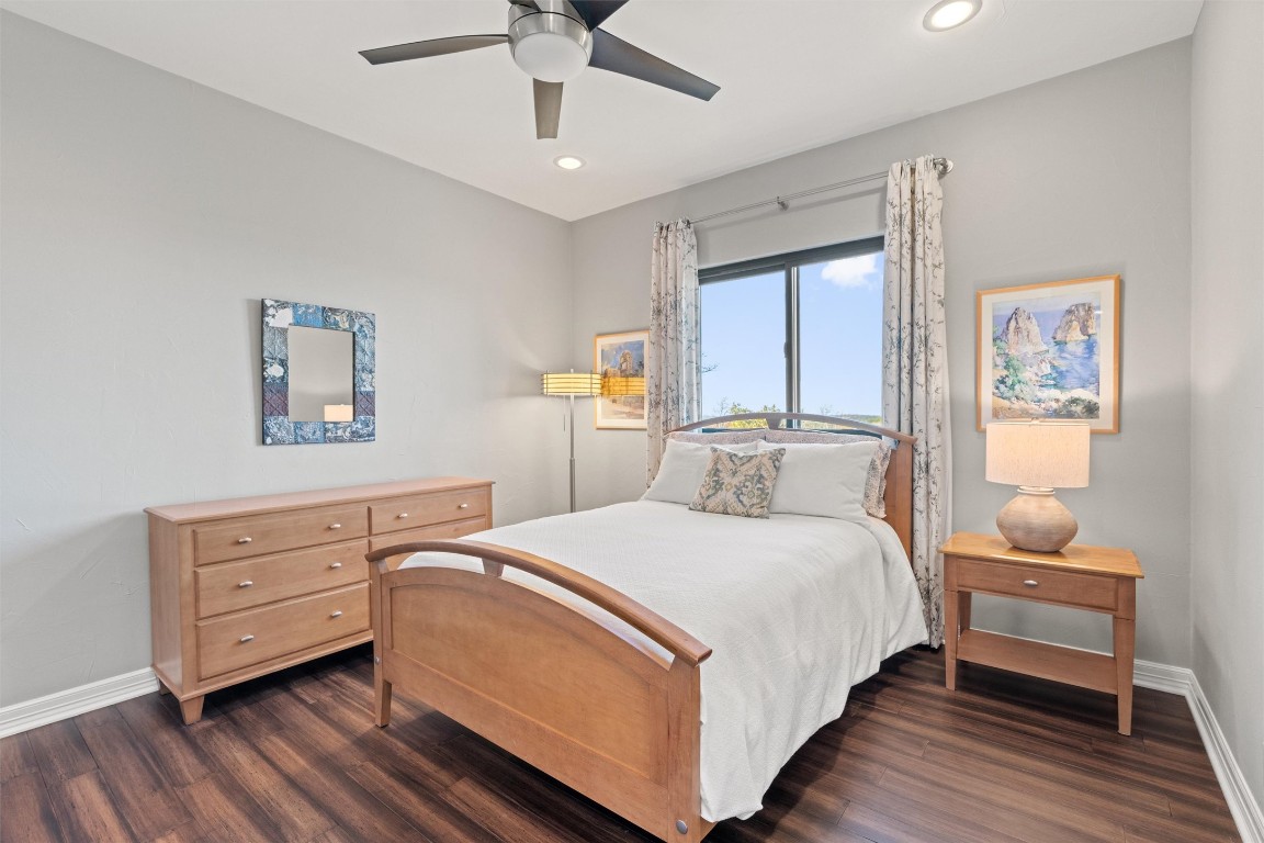 5706 Long Court Austin, TX 78730 - Photo 37 of 40 a bedroom with a bed and a dresser