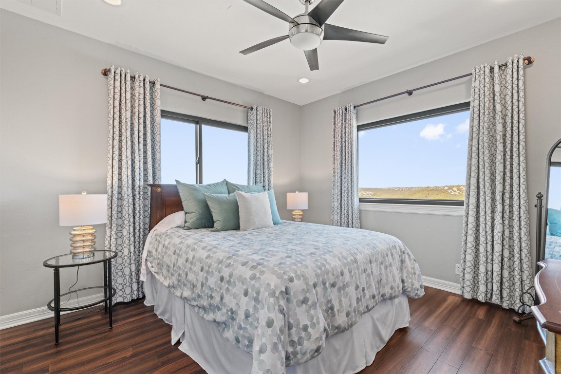 5706 Long Court Austin, TX 78730 - Photo 38 of 40 a bedroom with a large bed and a window