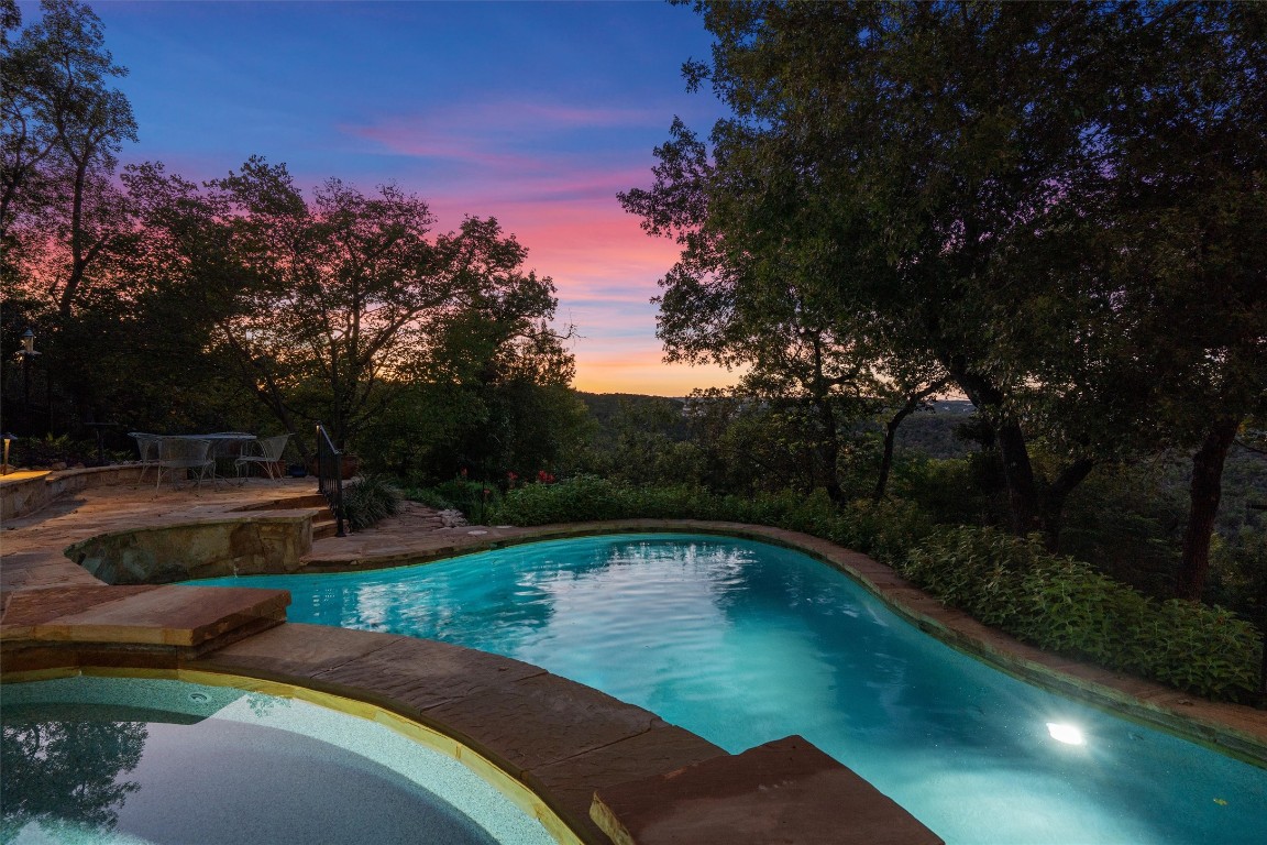 5706 Long Court Austin, TX 78730 - Photo 5 of 40 a view of a swimming pool with a yard