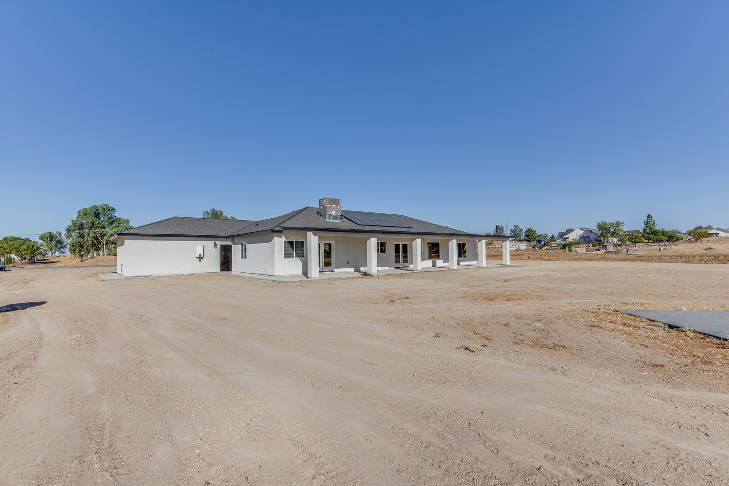 16639 Mark Road Madera, CA 93636 - Photo 28 of 33 a front view of a house with a yard and balcony