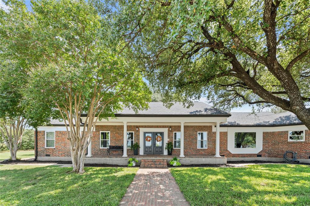 front view of a house with a yard