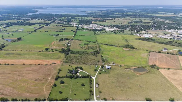 a view of house with yard in front of it