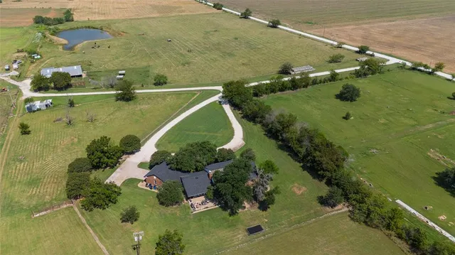 a view of a pathway both side of house