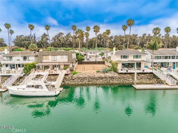 an aerial view of a house with outdoor space