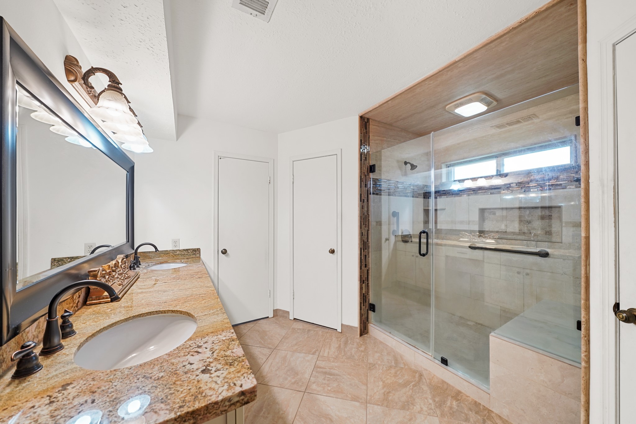 1706 Durfey Lane Katy, TX 77449 - Photo 11 of 29 a bathroom with a granite countertop sink a mirror and shower