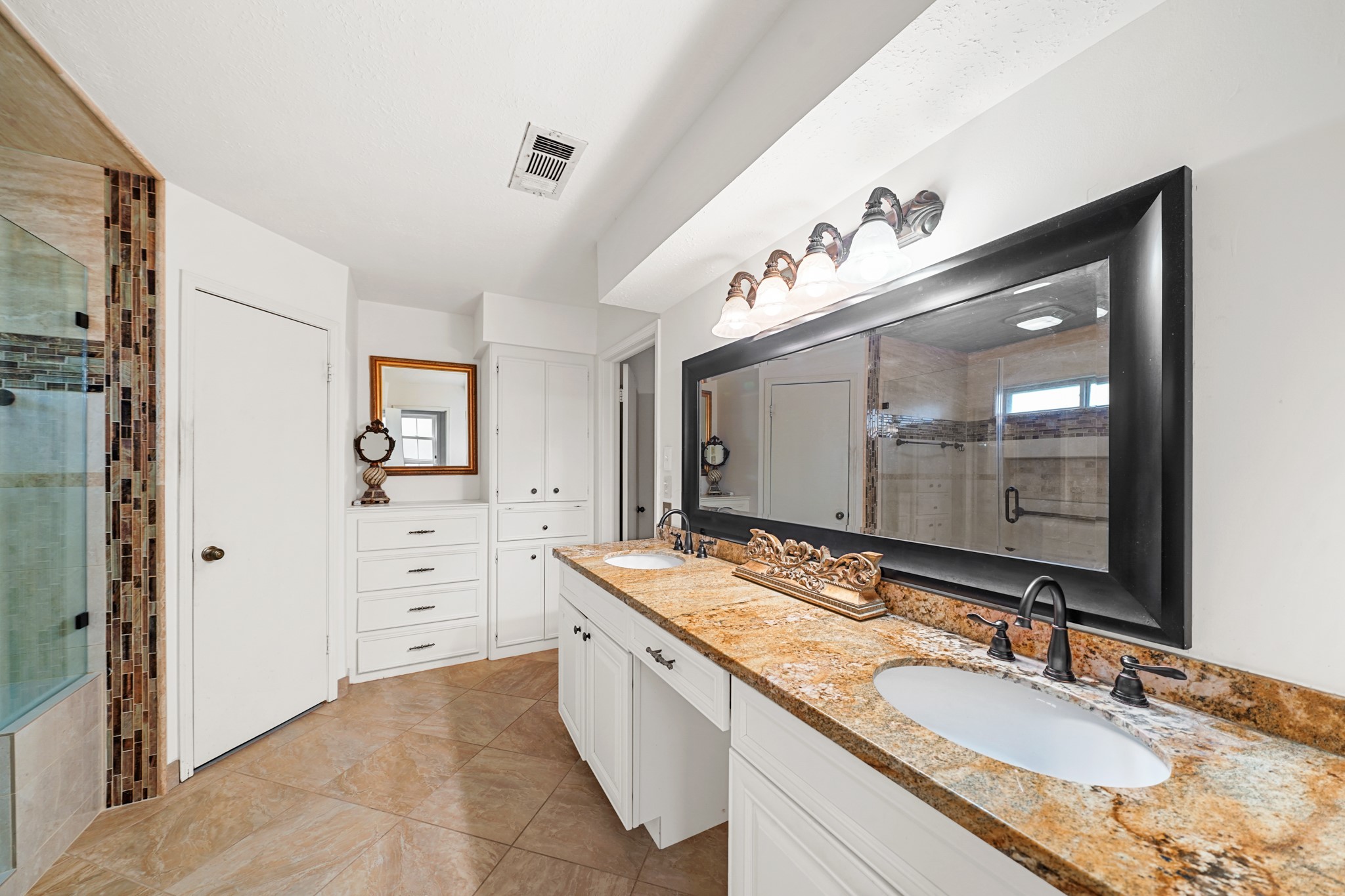 1706 Durfey Lane Katy, TX 77449 - Photo 12 of 29 a bathroom with a granite countertop double vanity sink mirror and shower