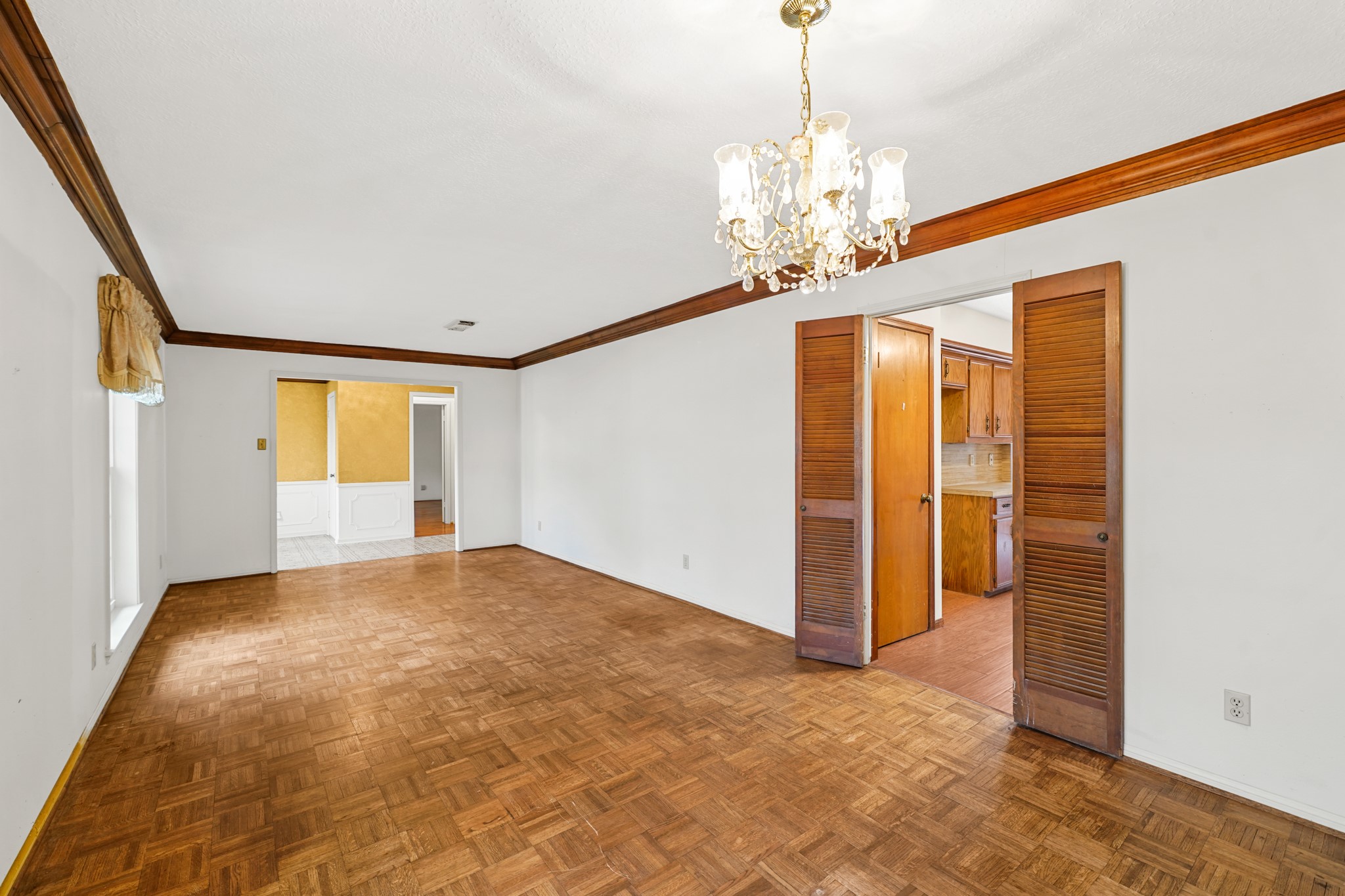 1706 Durfey Lane Katy, TX 77449 - Photo 15 of 29 a view of an empty room with a chandelier