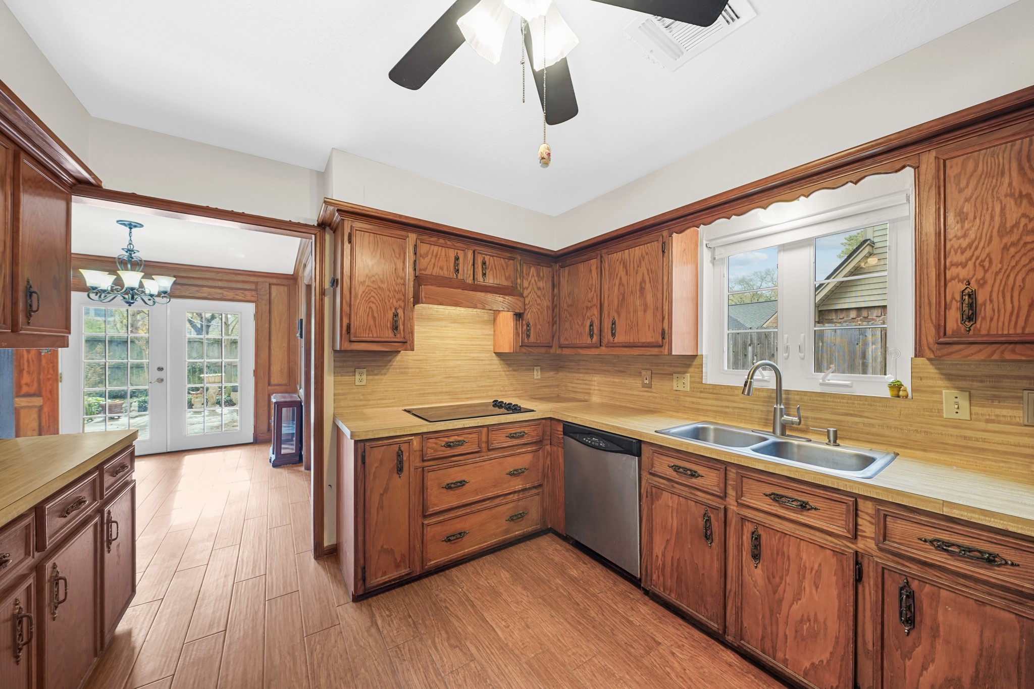 1706 Durfey Lane Katy, TX 77449 - Photo 16 of 29 a kitchen with wooden cabinets and sink
