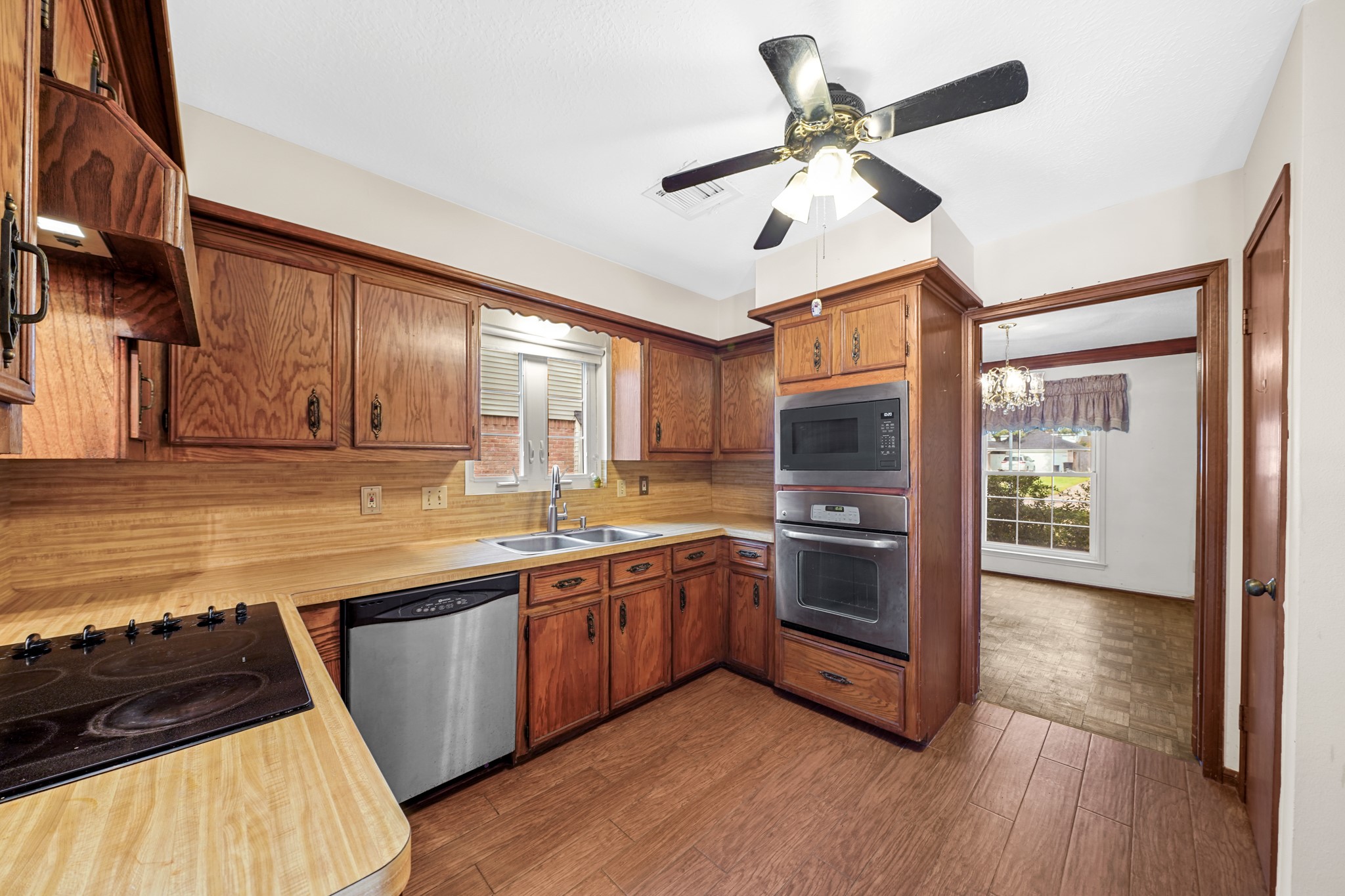 1706 Durfey Lane Katy, TX 77449 - Photo 17 of 29 a kitchen with stainless steel appliances granite countertop a stove and a sink