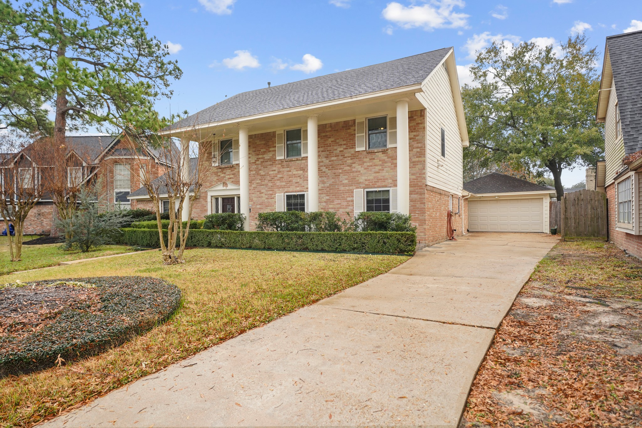 1706 Durfey Lane Katy, TX 77449 - Photo 2 of 29 a front view of a house with a yard and trees