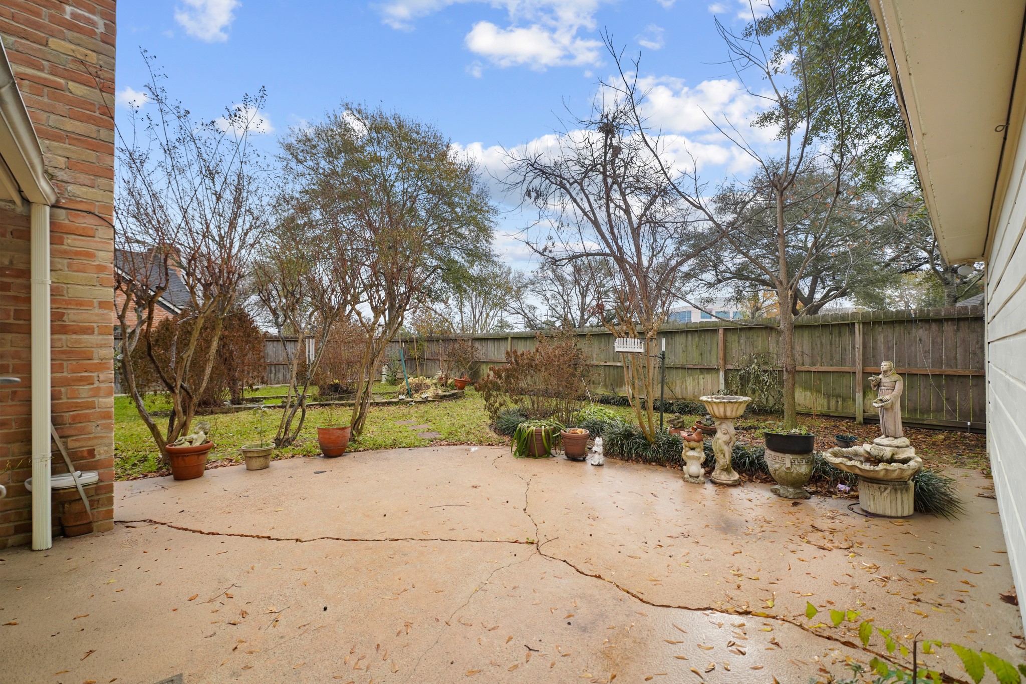 1706 Durfey Lane Katy, TX 77449 - Photo 3 of 29 a backyard of a house with table and chairs