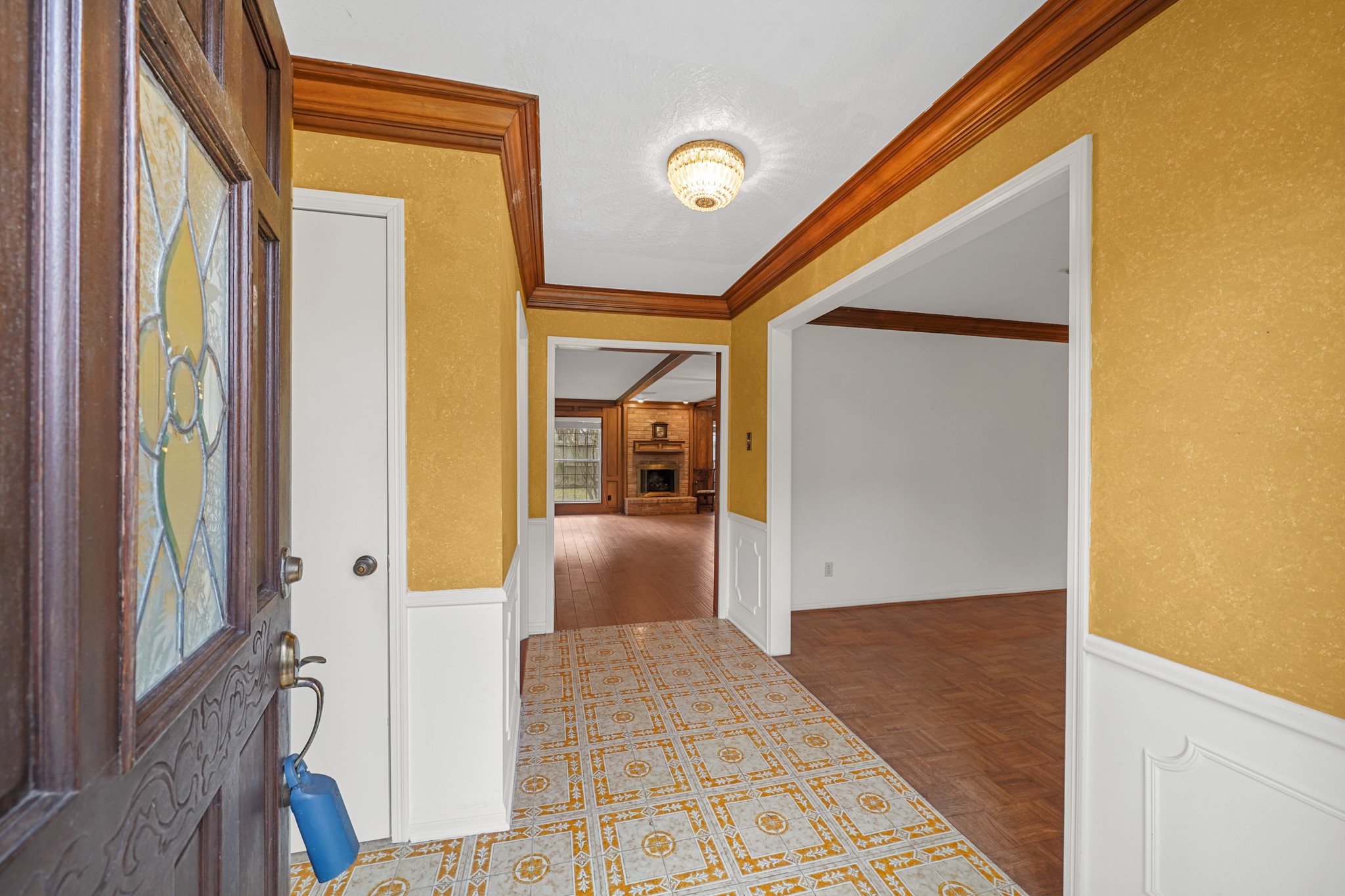 1706 Durfey Lane Katy, TX 77449 - Photo 6 of 29 a view of a hallway with wooden floor and a living room