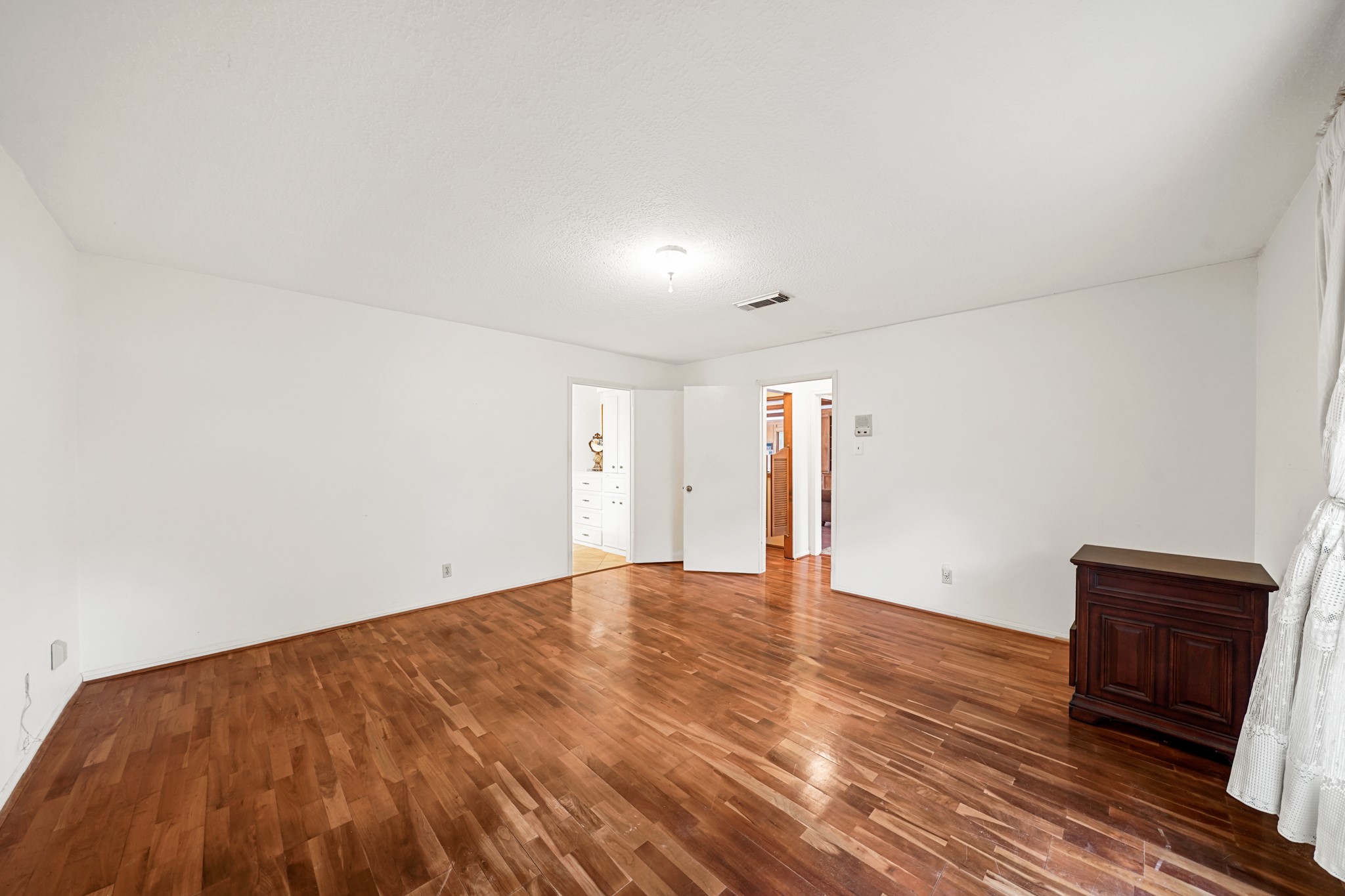1706 Durfey Lane Katy, TX 77449 - Photo 10 of 29 a view of an empty room and wooden floor