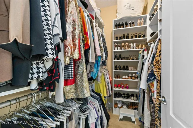 a view of roof deck with couches and wooden floor