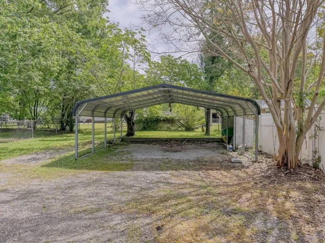 a view of backyard with green space