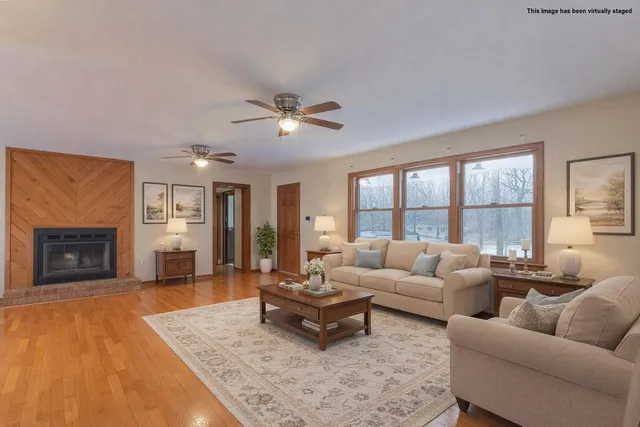 a living room with furniture and a fireplace
