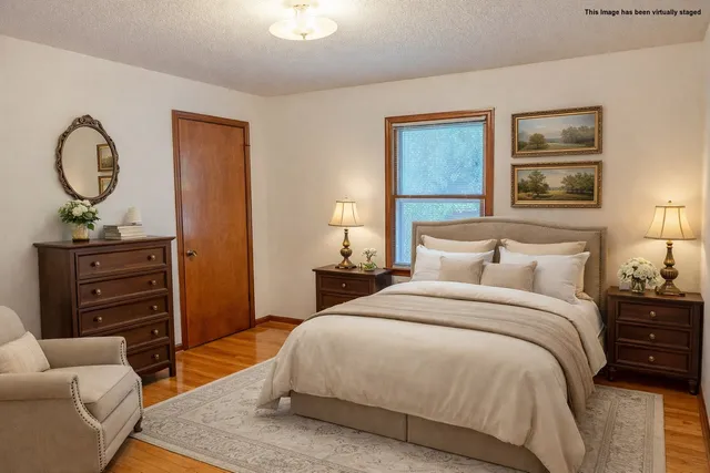 a bedroom with a bed and furniture