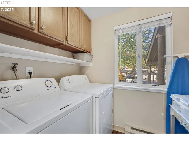 a view of a dining room with furniture and a window
