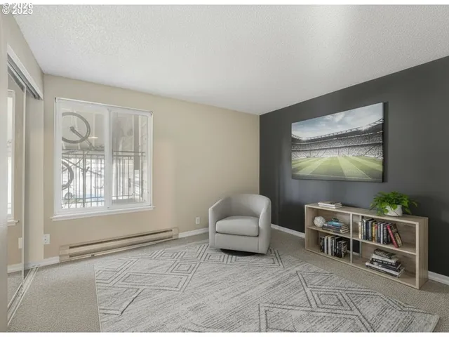 a bedroom with a bed a table and a window