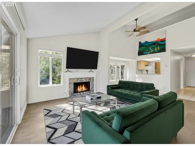 a view of empty room with a fireplace