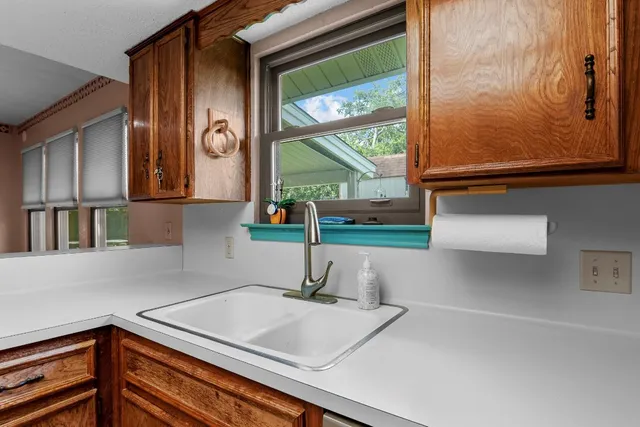 a kitchen with a sink and a window