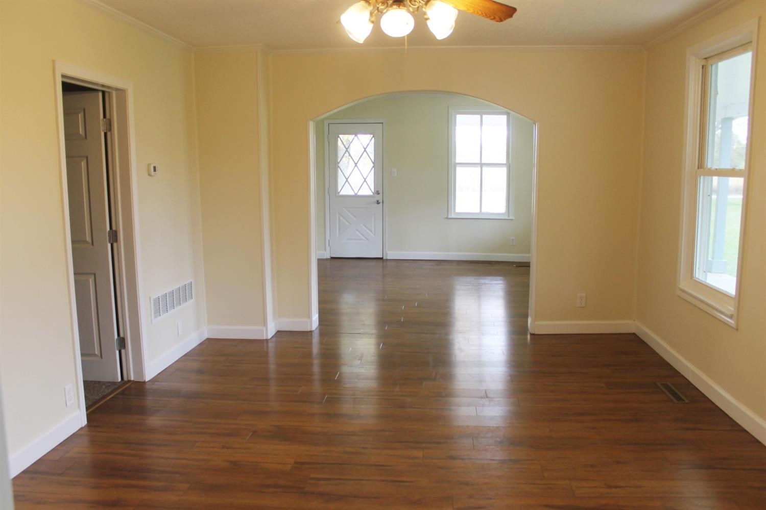 200 8th Avenue Northeast De Motte, IN 46310 - Photo 2 of 22 an empty room with wooden floor and windows