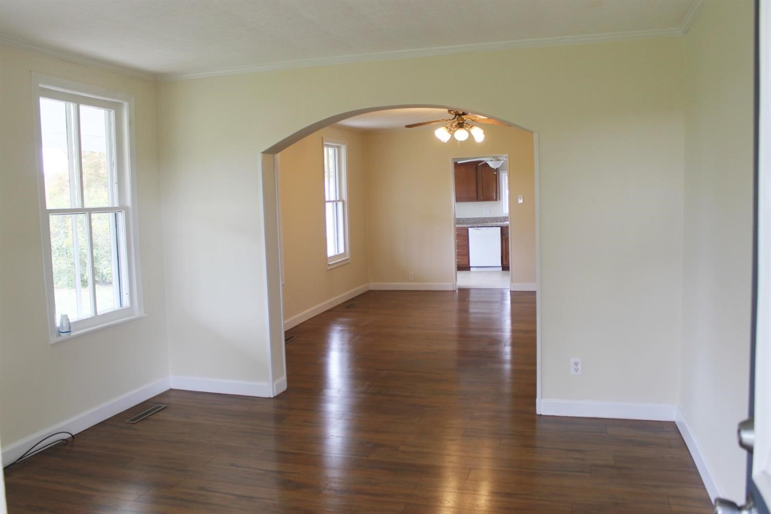 200 8th Avenue Northeast De Motte, IN 46310 - Photo 3 of 22 an empty room with wooden floor and windows