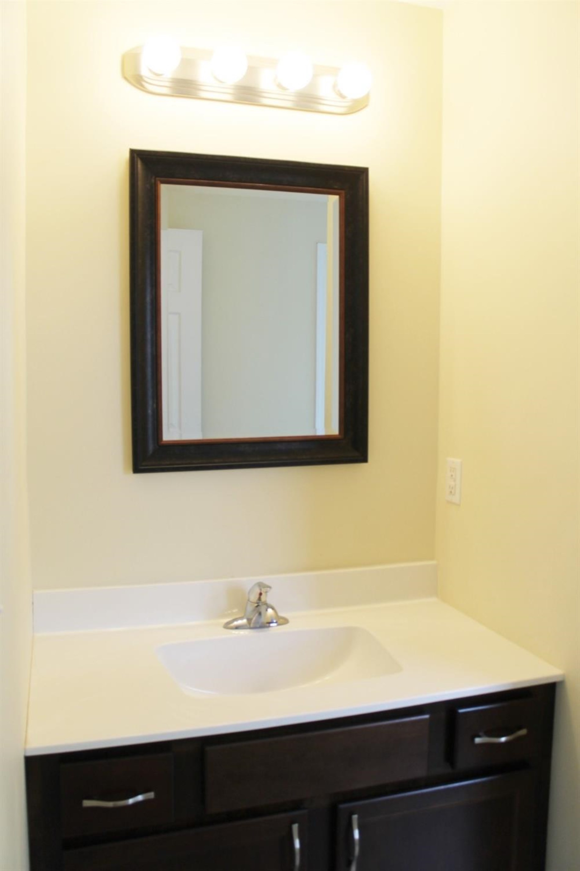 200 8th Avenue Northeast De Motte, IN 46310 - Photo 9 of 22 a close up of a mirror and vanity