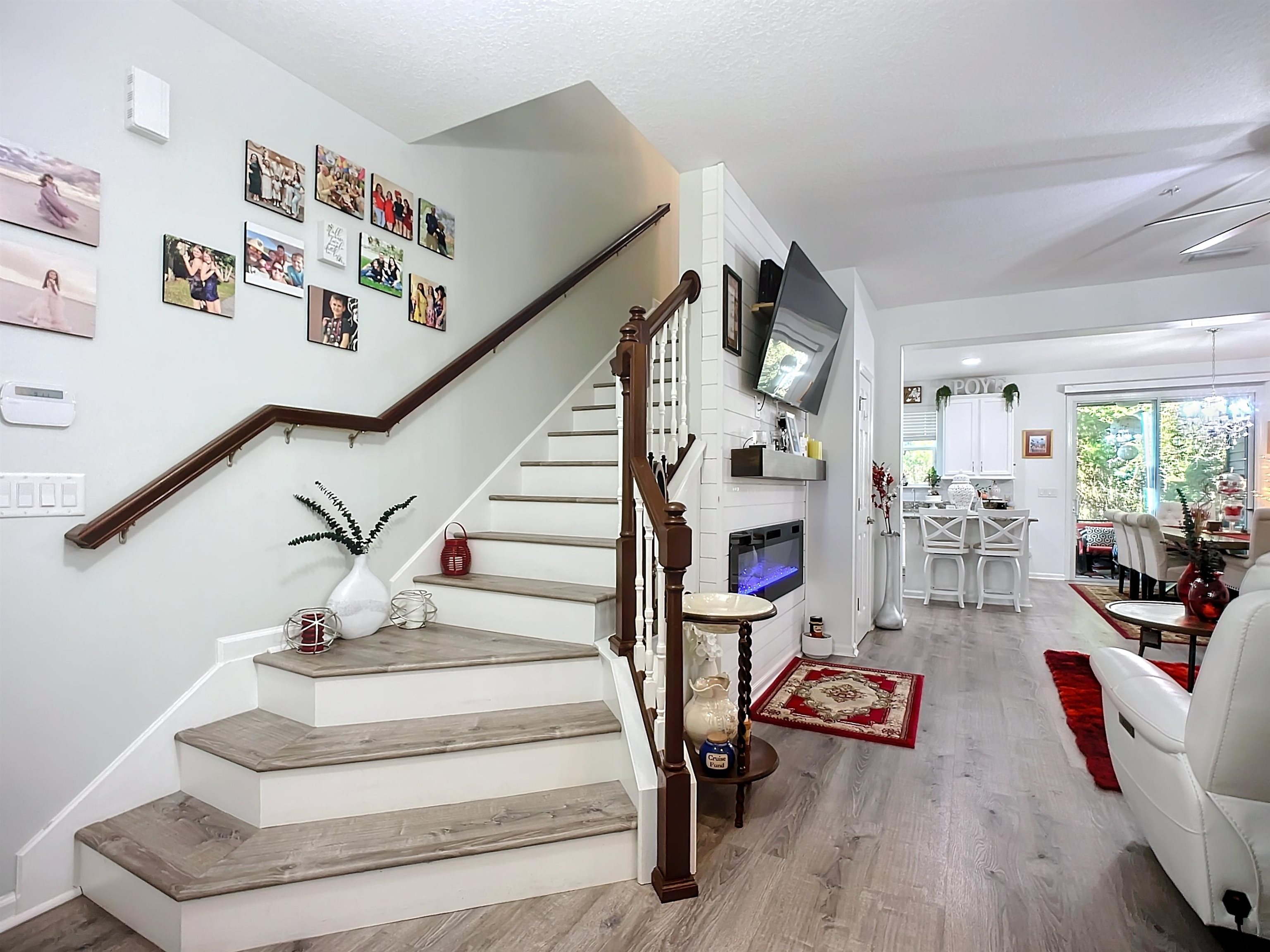a view of entryway livingroom and hall with wooden floor