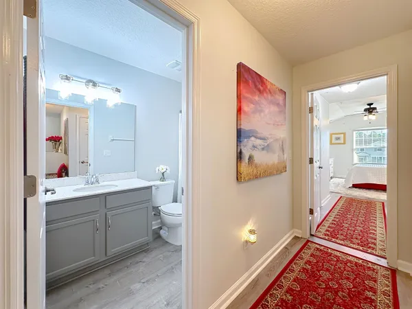 a en suite bathroom with a double vanity sink and a mirror