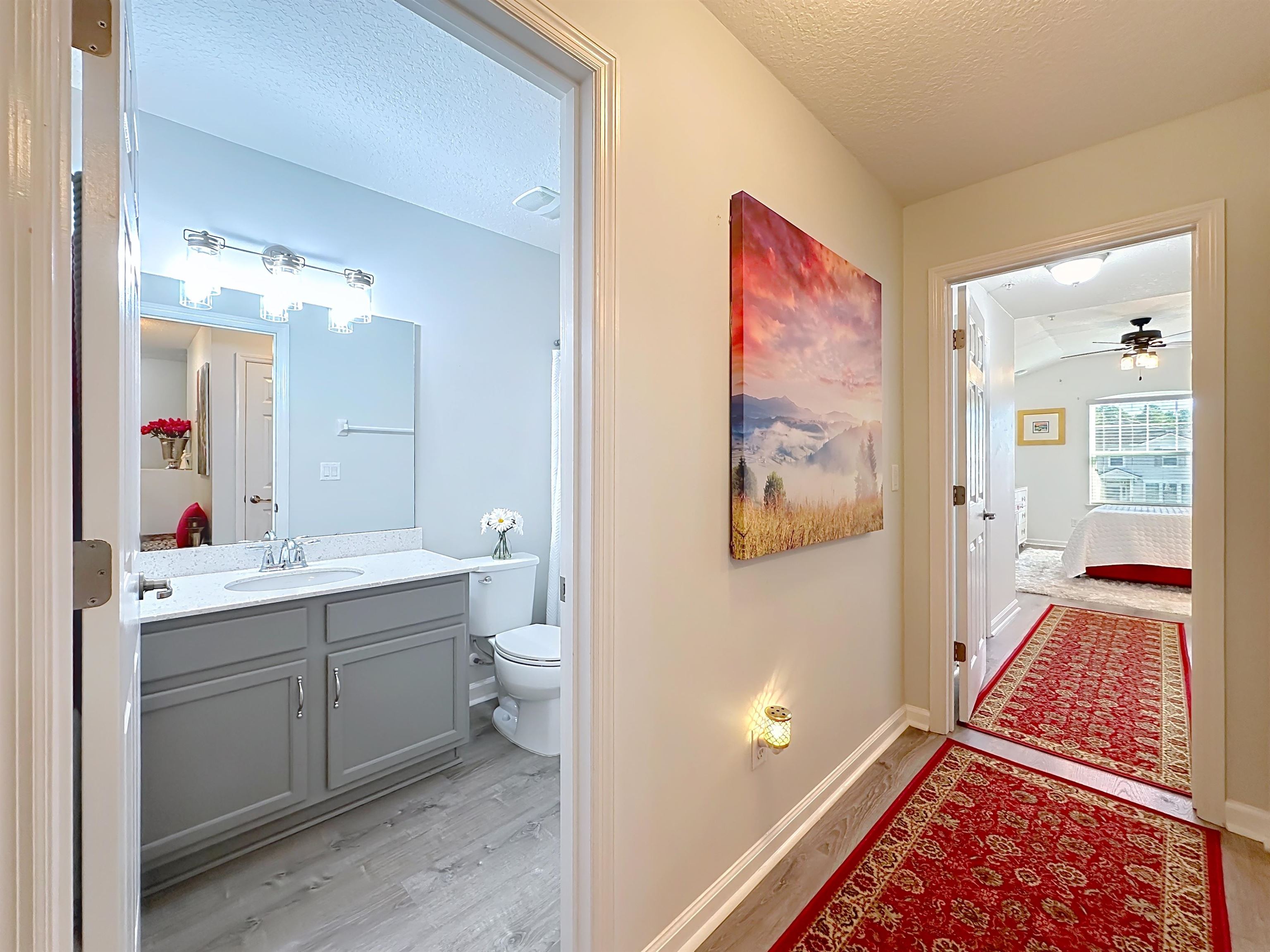 193 Paradas Place St. Augustine, FL 32092 - Photo 22 of 44 a en suite bathroom with a double vanity sink and a mirror