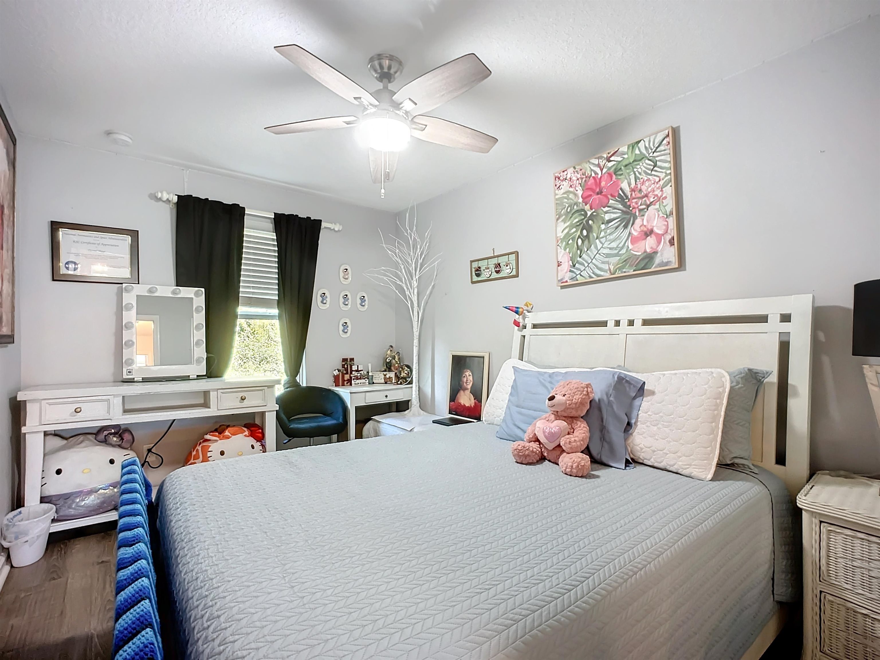 193 Paradas Place St. Augustine, FL 32092 - Photo 24 of 44 a bedroom with a bed and a chandelier
