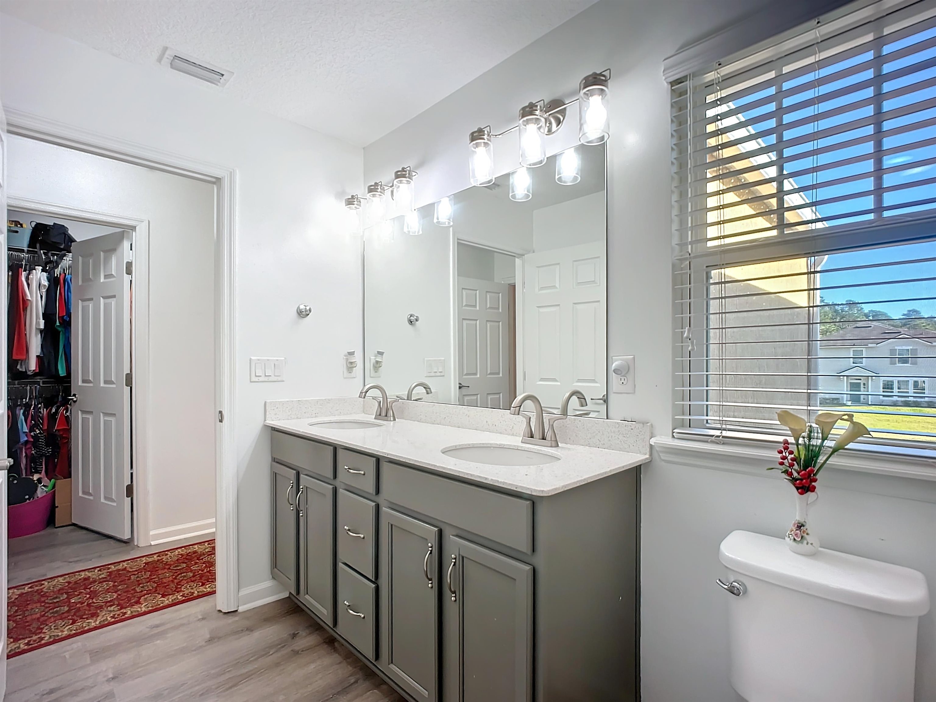 193 Paradas Place St. Augustine, FL 32092 - Photo 32 of 44 a bathroom with a sink double vanity and a mirror