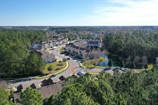 an aerial view of a house with a garden