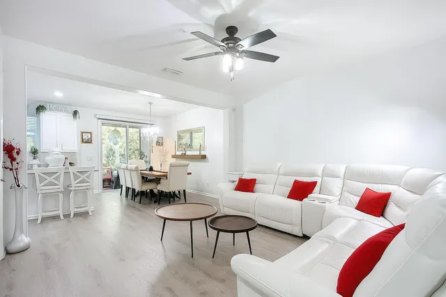 a living room with furniture and white walls