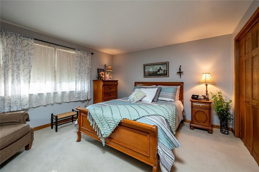 934 Pleasant Valley Road Mount Pleasant, PA 15666 - Photo 11 of 25 a bedroom with a bed and a couch