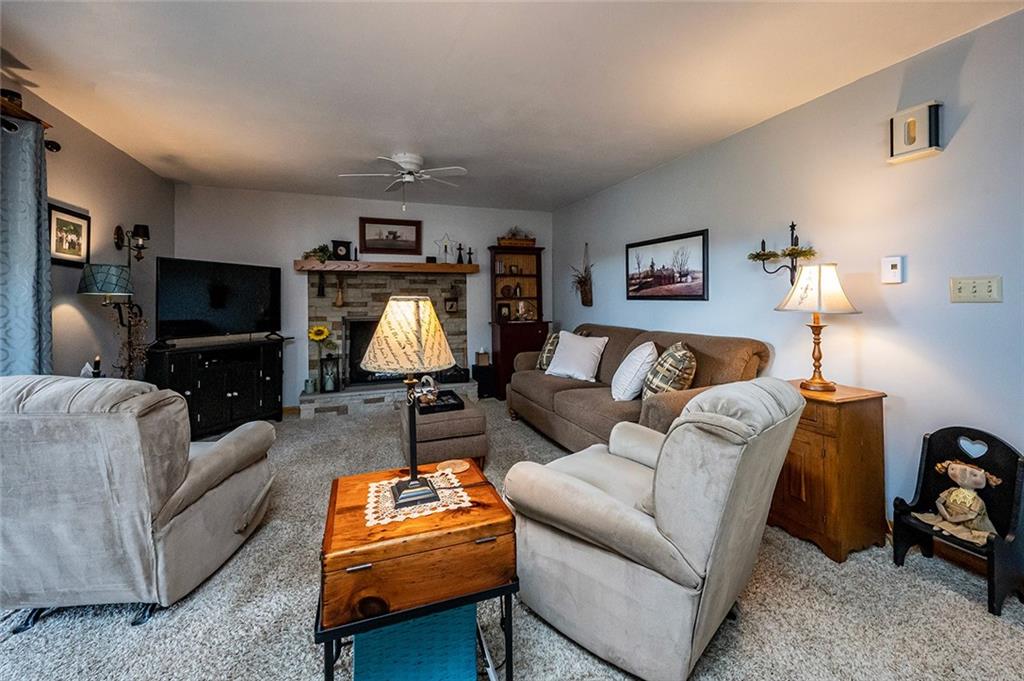 934 Pleasant Valley Road Mount Pleasant, PA 15666 - Photo 6 of 25 a living room with furniture and a lamp