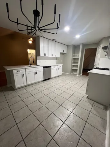 a kitchen with a sink and cabinets