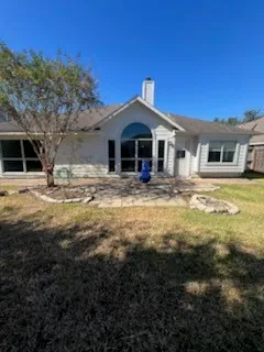 a front view of a house with yard and seating space