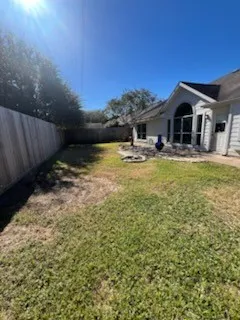 a swimming pool view with a seating space