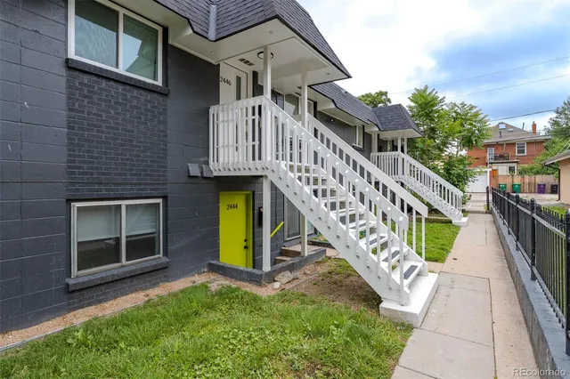 a view of a house with a small yard